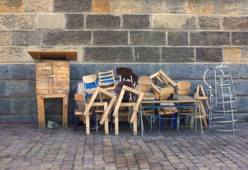 Professional team clearing out furniture from a modern Bethnalgreen home